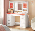 Coiffeuse WOLTU blanche avec miroir LED, 2 armoires vitrées, 9 tiroirs et support sèche-cheveux - vue d'ambiance en chambre